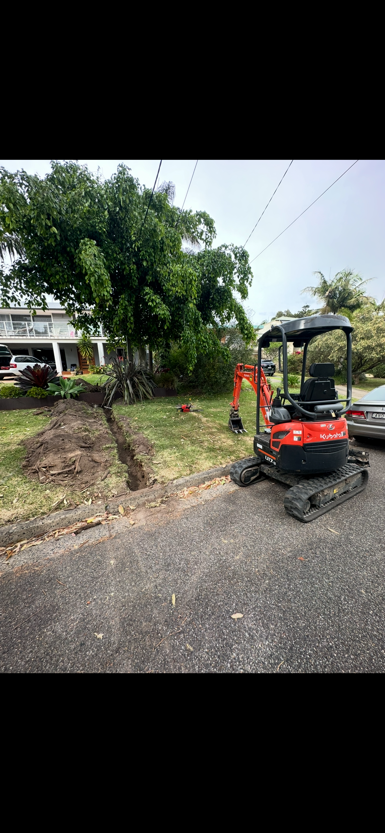 Excavator preparing a landscape site